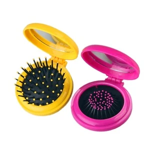 Hot sale folding makeup mirror comb Travel portable round plastic hair brush comb with mirror