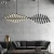 Import Minimalist modern acrylic led hanging pendant light simple design metal office nordic black linear wire ceiling pendant lamp from China
