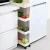 Import Multi-purpose 4 Tiers  Kitchen Vegetable Trolley Movable Storage Utility Rolling Cart with wheels from China