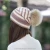 Import Wholesale factory direct sales winter pompom knit hat with stripe pattern cheap price knitting beanie hat from China