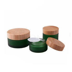 Customized green glass 15ml 30ml 50ml cosmetic round bamboo jar