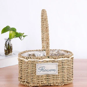 handmade straw braid woven flower basket with plastic liner/wholesale straw grass rope flower gift basket with plastic liner