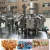 Import Semi Automatic  Semi Automatic Cap Filler Water Return Tumbling Coke Glue Glass Bottle Filling Machine Wine from China