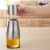 Import 320ml Stainless Steel Plus Glass Olive Oil Dispenser Vinegar and Soy Sauce Bottle for Kitchen from China