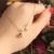 Import Korean dainty elegant brass 14K real gold plated rose flower micro inlay zirconia long pendant necklace for women jewelry from China