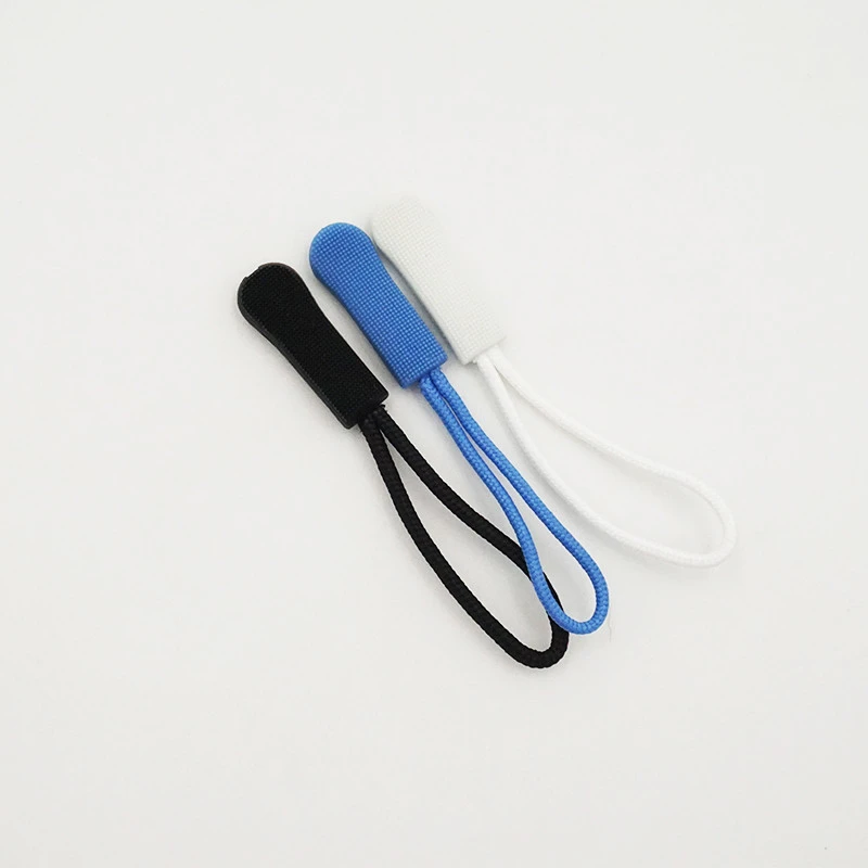 Wholesale embossed soft silicone rubber puller zipper head