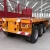 Import 3 Axle good used 40ft flatbed Container Semi Trailer for sale from China
