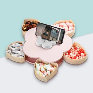 The same paragraph vibrato creative flower lazy candy candy plate tiktok melon seeds rotating device, fruit box, with a cover.