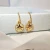 Import Octagonal Compass Shell Earrings from China