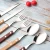Import 304 stainless steel silver restaurant hotel spoon fork flatware set with wooden handle from China