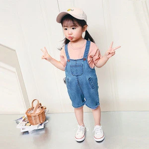 Lovely casual style girl two suits with t-shirt and jeans rompers