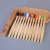 Import Toothbrush with Bamboo Handle Colorful Head Bamboo Toothbrush Wholesale Environment Wooden Rainbow Bamboo Toothbrush from China