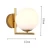 Import Art Deco Indoor Decorative Gold Base White Globe Glass Ball Wall Lamp Sconce for Home Living Room from China