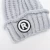 Import EE234 Winter Cable Knitted Beanie Caps with Decoration Label Slouch Thick Ski Hats Soft Fleece Lined Women Warm Knit Beanie Hat from China