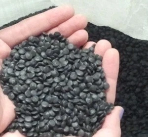 LDPE granules. Recycled plastic from industrial film, extrusion grade, black colour.