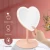 Import NEW ORIGINAL Fashionable Factory Direct Supply Heart-Shaped Detachable Good Quality Hand held Table LED Makeup Mirror from China