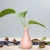 Import Simple ceramic vase creative household desktop decoration tripod hydroponic vase decorative vase ceramic aromatherapy bottle from China