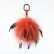 Import 15cm big pom pom with feather key chain raccoon fur bobble bag charm from China