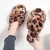 Import fashion female home soft leopard cross winter custom plush fur furry slippers from China