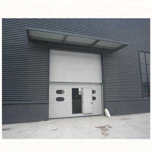 Sectional over head lifting hangar door with pedestrian door and windows kit