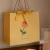 Import High Quality Reusable Cardboard Gift Bag Tote Shipping Bags With Handle For Gift Packing from China