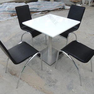 white stone tables and chairs for restaurant