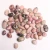 Import Wholesale Natural Pink Rhodonite Orlets Crystal Gravel Stone Tumble Stone from China