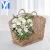 Import Cheap Large handmade water hyacinth woven flower basket portable storage basket with handle from China
