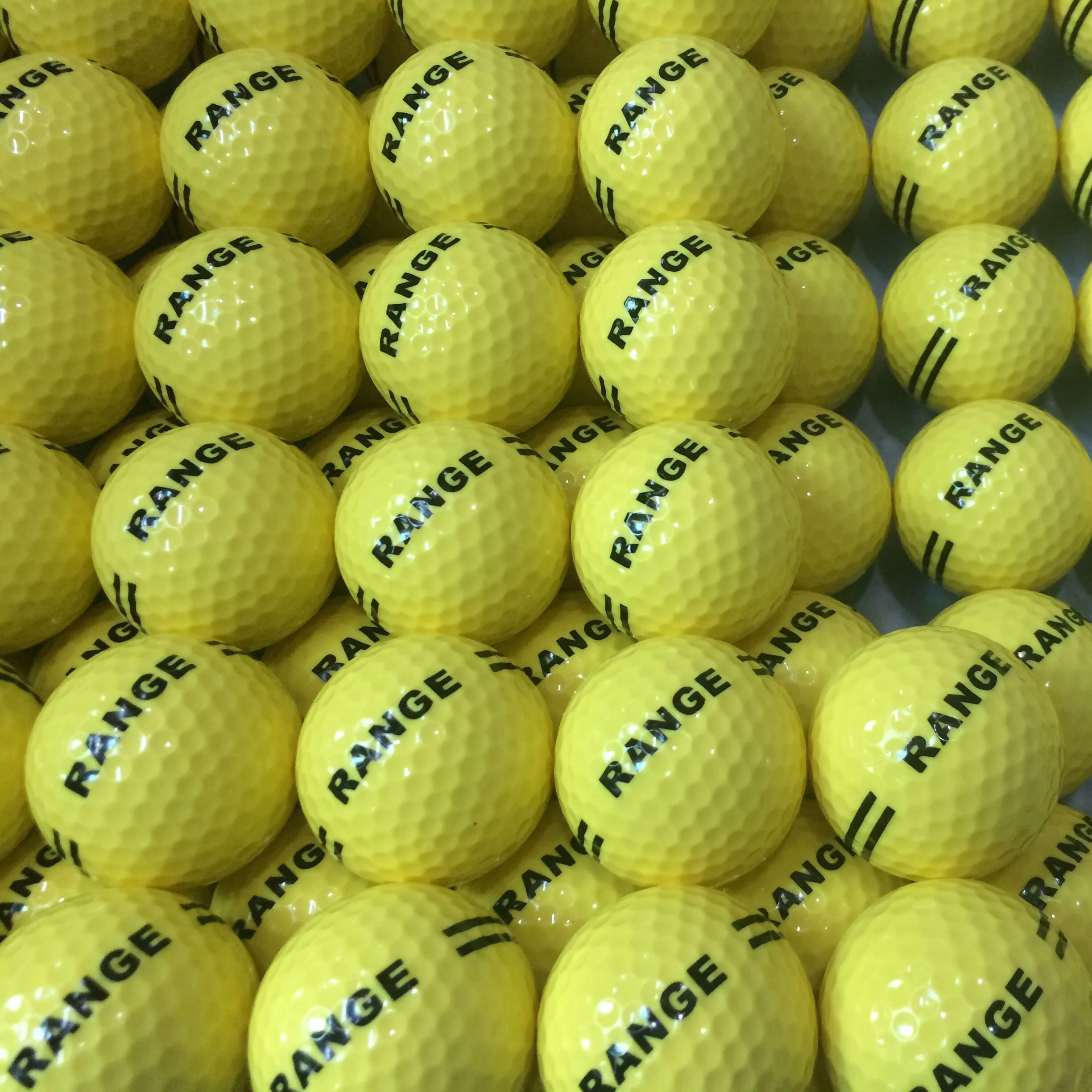 Limited flight yellow range golf ball with customized LOGO