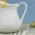 Import wholesale stock manufactures pure white hotel ceramic milk jug from China