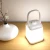 Import 2021 Newest Portable 3 Color Dimmable Hand Lamp With USB Charging Base LED Smart Feeding Night Light Bedside Lamp Hanging Lamp from China