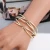 Import AmorYubo 18k luxury brand jewelry gold plated women bangle gold bracelet from China