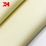 Kahn low MOQ 120gsm 40*40 133*72 organic stock cotton poplin dyed fabric plain baby yellow color custom design for baby clothes
