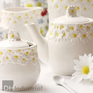 Ceramic white glazed sugar pot with a pretty 3D daisy pattern lining the top