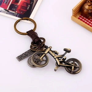 Creative Key Chain Men&#39;s and Women&#39;s Leather Pendant Small Gift Alloy Bicycle Retro Woven Leather Key Chain