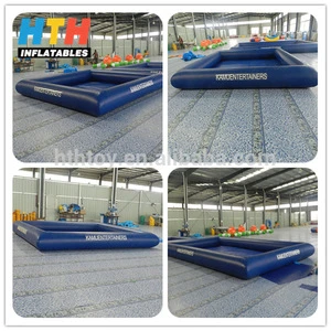 Dark blue floating inflatable boat swimming pool