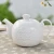 Import Porcelain embossed teapot ceramic big water jug 1.4L kettle for restaurant from China