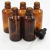 Import Wholesale essential oil glass bottle cosmetic packaging and printing bottles in store from China
