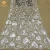 Import embroidery lace fabric knitting silvery sequins tulle lace embroidered tulle lace from China