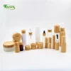 Factory sale perfume bottles 50ml 100ml 150ml Frost glass lotion bottle with bamboo mist sprayer/bamboo lotion pump/bamboo cap