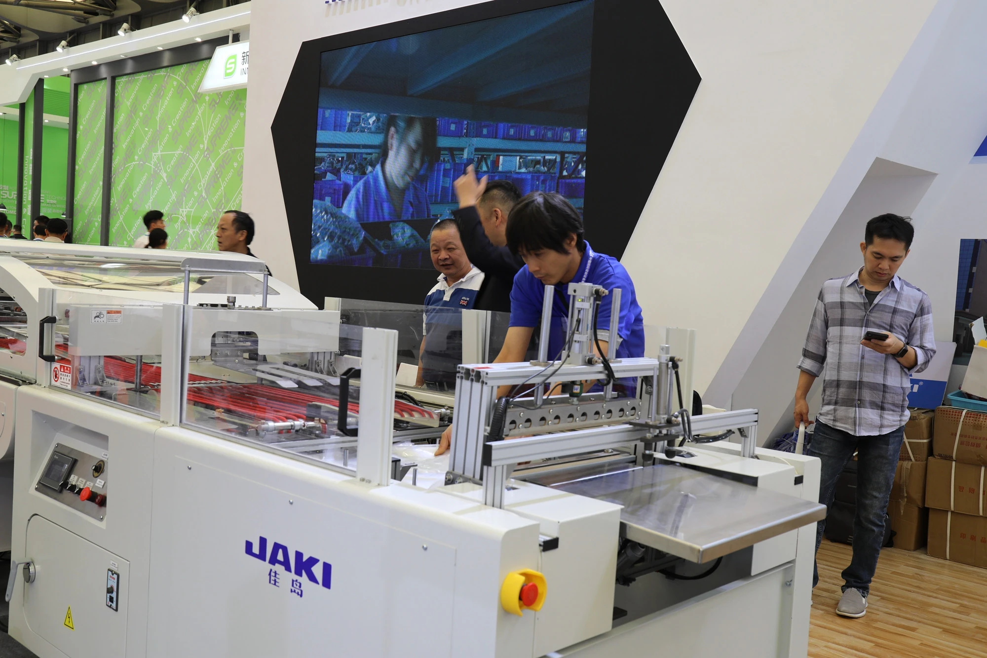 JAKI cheap price fully automatic garment folding machine joint with packing machine