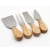 Import Rubber wood round shape 4pcs cheese cutting board knife set for gift from China