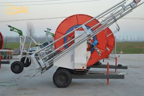 Agricultural hose reel with boom cart with travelling rain gun