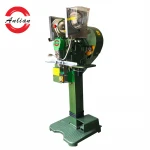 Automatic plastic button attaching machine for face shield