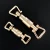 Import Carosung Custom High Quality Gold Metal Shoulder Strap Bag Lock Slide Press Buckle Bag Closure Hardware from China