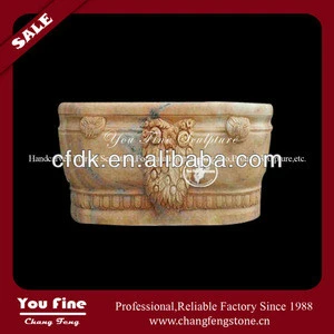 Carved yellow stone marble freestanding tub