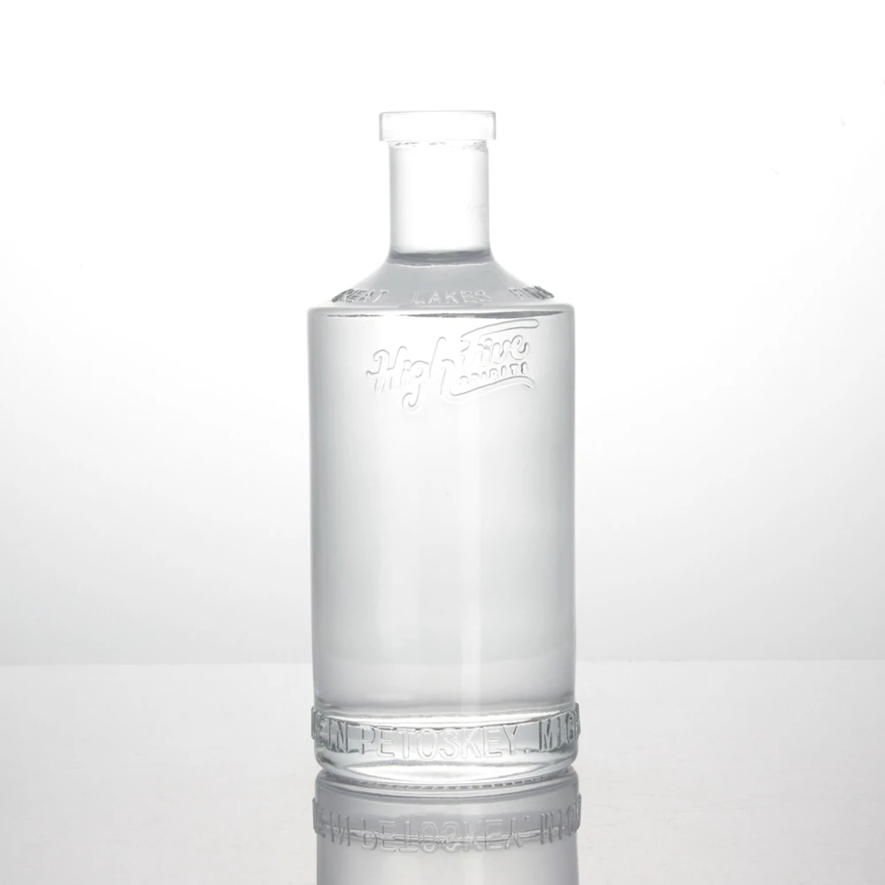 Customized embossed logo 750ml 750 ml extra flint tequila spirit whiky vodka gin transparent glass bottle with cork top