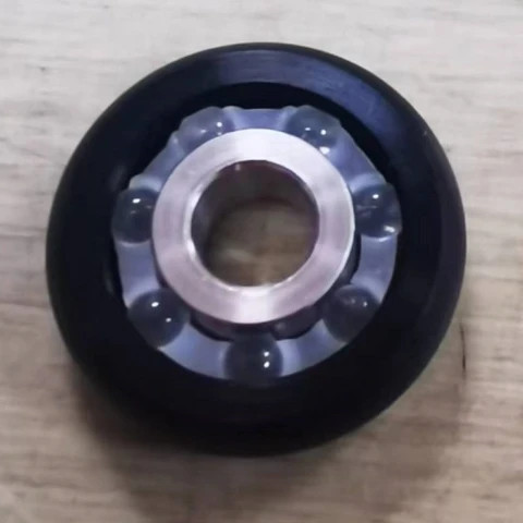 ESD or Conductive stainless steel inner ring upe plastic roller wheel bearing with glass balls pom cage