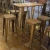 Import Singapore cheap bistro adjustable leg risers bar chair with armrest rattan wicker bar stools from China