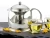 Import Wholesale Chinese Unique Half Moon Coffee & Tea Sets High Heat resistant Borosilicate Glass Tea Pot Teapot With Infuser from China